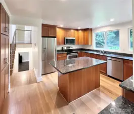 Enjoy the highly functional and efficient workspace designed for serious cooking, featuring SS appliances, ample granite countertops, and an abundance of storage.