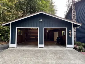 Two car garage with shop and covered entry to the home.