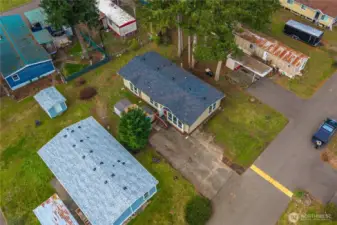 Aerial view showcases the home’s placement within the community and its surrounding green space.