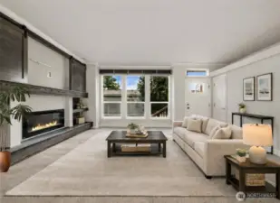 Spacious living room offers a bright, open feel with plush carpeting and a layout ideal for relaxing or entertaining.   (photo virtually staged)