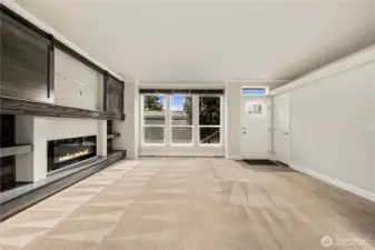 The same view of the living area (unstaged) highlights the room’s flexibility and seamless flow for everyday living.