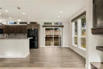 Light and bright dining area (unstaged) offers easy access to the outdoors and a seamless connection to the kitchen.