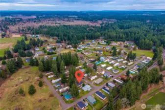 Aerial view showcases the surrounding neighborhood and the home’s convenient location within the community.