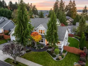 Front exterior of Horizon West home for sale in North Gig Harbor featuring manicured landscaping, covered porch, and exceptional curb appeal in a gated community near Downtown Gig Harbor, Costco, and Hwy 16.