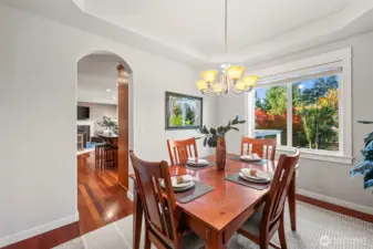 Formal dining room in Horizon West home for sale in North Gig Harbor featuring elegant Brazilian cherry hardwood floors, large windows, and space for hosting gatherings—located in a gated community near Downtown Gig Harbor and Hwy 16.