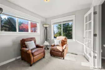 Sitting room inside the primary suite of Horizon West home for sale in North Gig Harbor, ideal for a private office, reading nook, nursery, or cozy lounge—offering flexibility and comfort within this spacious retreat.