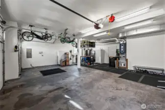 Spacious 3-car garage in Horizon West home for sale in North Gig Harbor featuring built-in storage, workspace area, and ample room for vehicles, tools, and recreational gear—ideal for active Northwest living.
