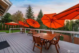 Expansive Trex deck in Horizon West home for sale in North Gig Harbor offering durable, low-maintenance outdoor living space—perfect for entertaining, relaxing, and enjoying the fenced backyard in this gated community.