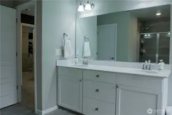 Primary bathroom with dual vanity sinks