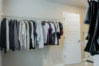 Expansive walk-in closet with ample storage