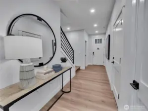 Inviting entry hall showcases 9' ceilings, which are incorporated on all levels.