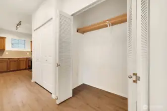 Large hallway closet with lots of storage.