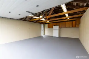 Detached garage with 220V power. Extra fridge stays!