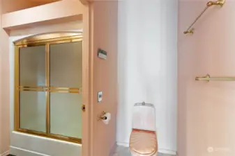 Private commode with door to the shared shower space