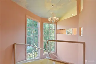 Huge windows grace the stairs from first to third floor for brilliant light throughout