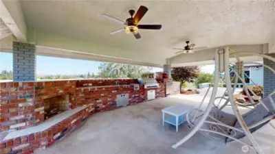 Stunning covered yard perfect for hosting gatherings while enjoying breathtaking views of the surrounding landscape