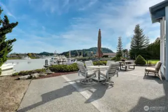 Expansive patio perfect for outdoor living, offering breathtaking water views and direct access to your shared dock.