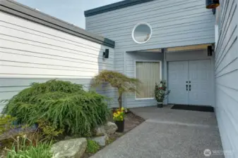 Welcome home! This stunning entry features elegant double doors, plenty of space for custom landscaping, and beautiful overhead windows that flood the space with natural light, creating a bright and inviting first impression.