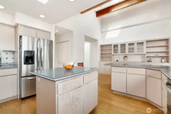 The light and bright kitchen offers abundant storage and built-ins close by to display your favorite collectibles.