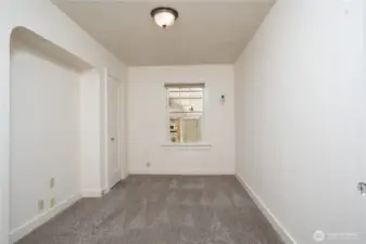 Back inside, we have the first of four bedrooms.  Hardwoods under carpeting.