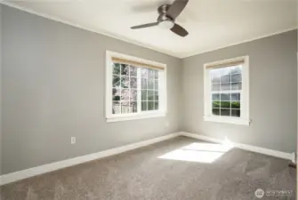The second main floor bedroom is good sized and looks out onto the beautiful back yard.