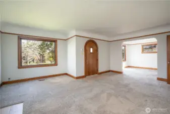 Living room to dining room view- everything is in such good condition with all the charm intact.