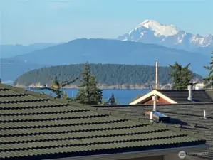 That is the most incredible mountain on the planet if you ask me.  Have you driven up to Artist’s Point yet at Mt Baker?  It is as unbelievable as this view.  This roof is made of steel with a coating to make them look like tiles.  It was pressure washed in July 2025.