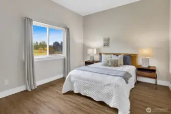 ADU bedroom with views of orchard and gardens.