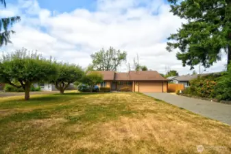Home is set back from the road and features fruit trees and new cement drive, sidewalks and garden edging.