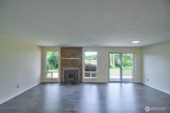 Great room style living/dining & kitchen with wood burning stove for winter evenings.