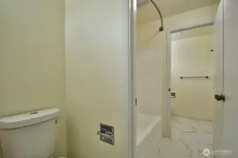 Hall half bath that shares the central tub/shower