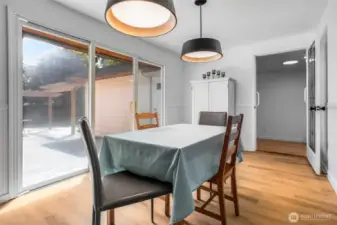 Main area dining room off kitchen, with wall of windows and slider access to patio