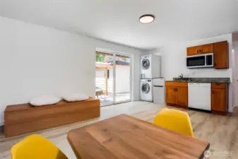Virtually staged ADU living room with kitchenette and slider access to patio