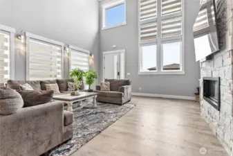 View of living room with, full of natural light with lots of windows.