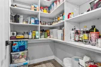 Walk in pantry next to the kitchen.