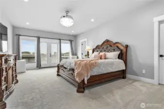 Primary suite upstairs with balcony