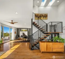 Staircase leads to the primary suite which is a floor unto itself.