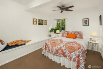 One of two lower level bedrooms. Spacious and bright and perfect for creating a space to read and enjoy the quiet.