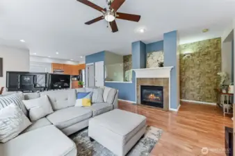 A cozy gas fireplace adds warmth and ambiance to the main living space, creating the perfect spot to unwind. LVP flooring extends throughout the living areas and bedrooms, offering both style and durability.