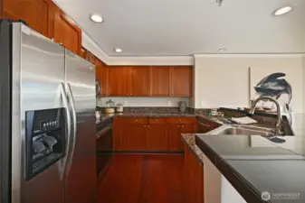 Kitchen with Cherry cabinets, stainless steel appliances, granite countertops,
