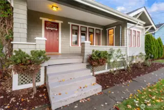 Covered front porch perfect for year round relaxation and watching the passerbys