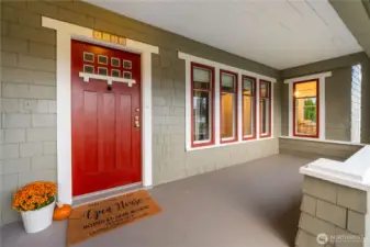 Ample sized covered front porch provides space for furniture and is a welcoming entry to this charming home.