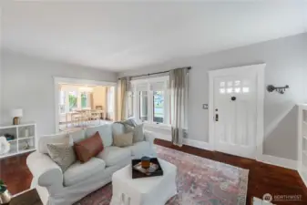 Light and bright and welcoming front room leads to formal dining room and kitchen