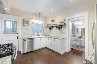 Updated kitchen offers stainless appliances, gas range and built ins perfect for storage