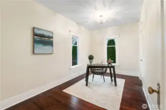 Main floor office with closet and original floors