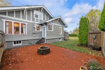 Cobblestone patio with firepit offers great spot to socialize and enjoy the outdoors