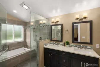 Primary ensuite, walk-in shower with soaking tub and a double sink quartz vanity.