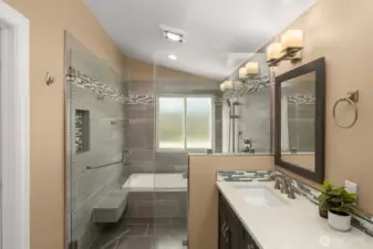 Primary ensuite, walk-in shower with soaking tub and a double sink quartz vanity.