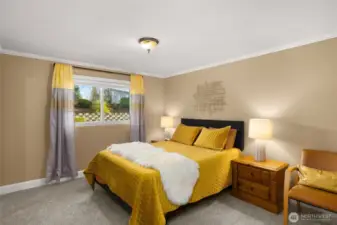 Secondary bedroom on the main level with new carpet.