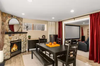 Lower level daylight basement living room with a gas fireplace.